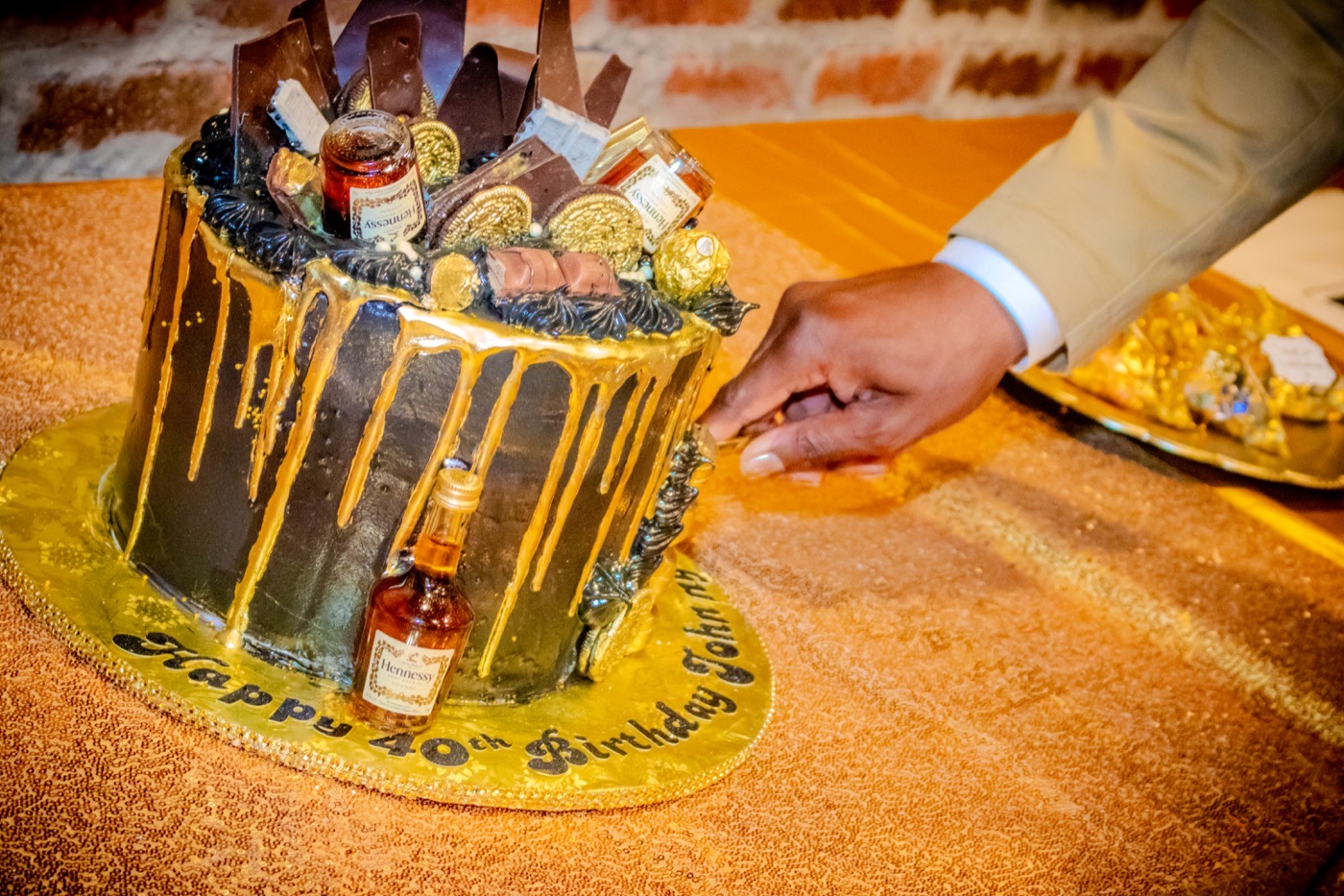 40th birthday celebration cake being cut at a private event, by TECHINRI AGENCY