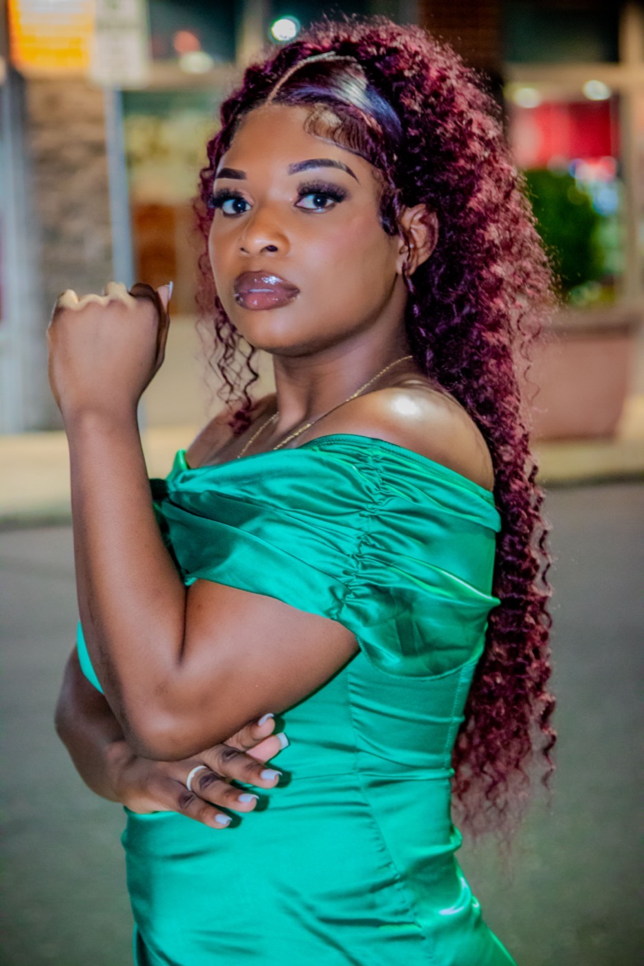 Editorial side-profile birthday portrait in a green satin dress, by TECHINRI AGENCY